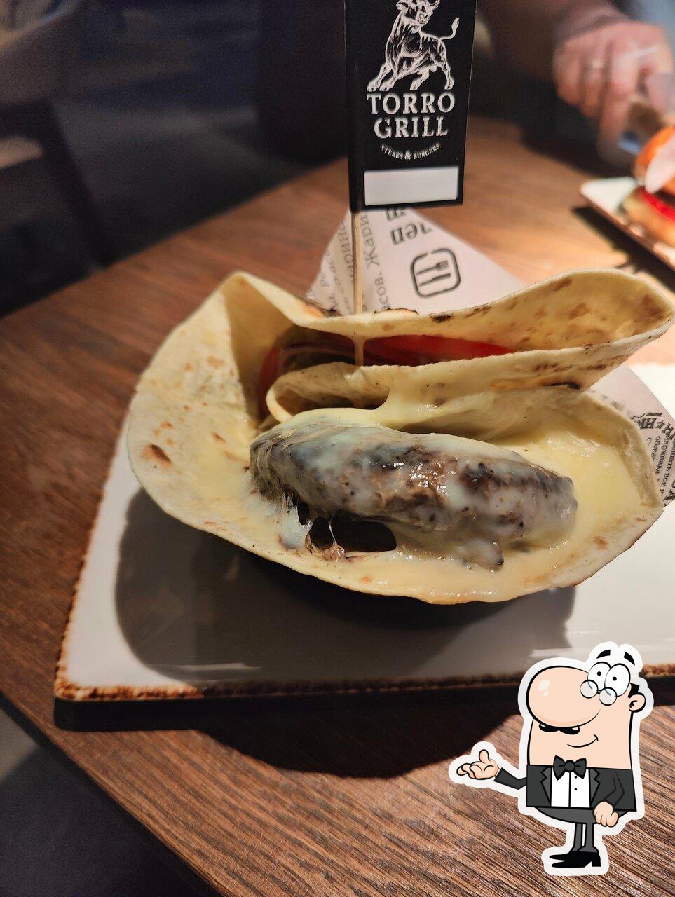 Забронируйте столик в "Torro Grill".